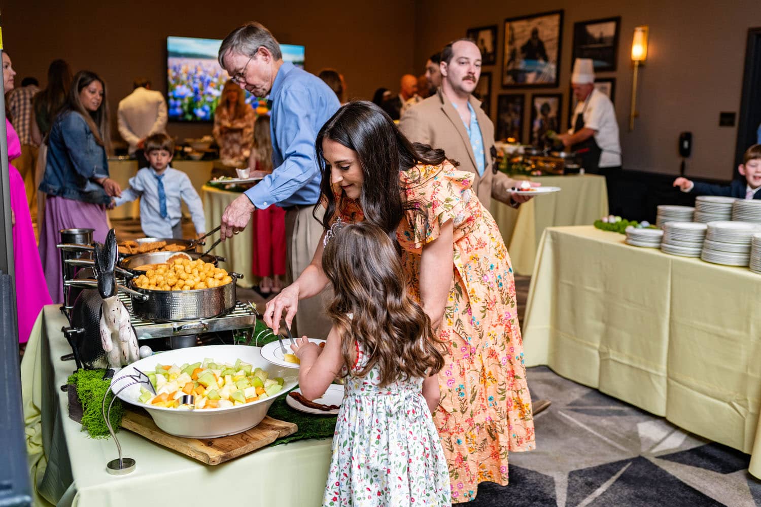 A family at a table inside the Crystal Ballroom Easter Buffet