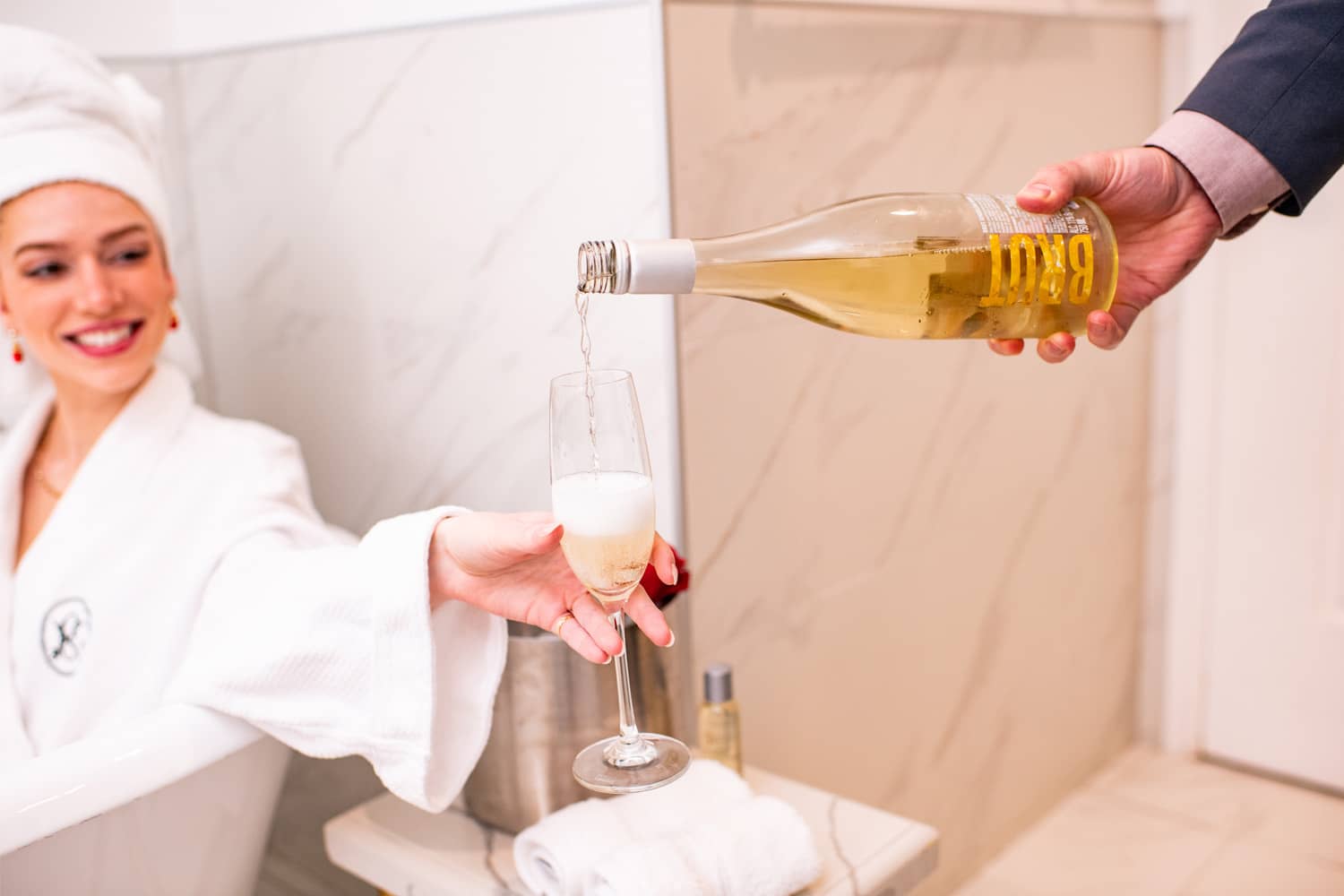 A glass of champagne being poured