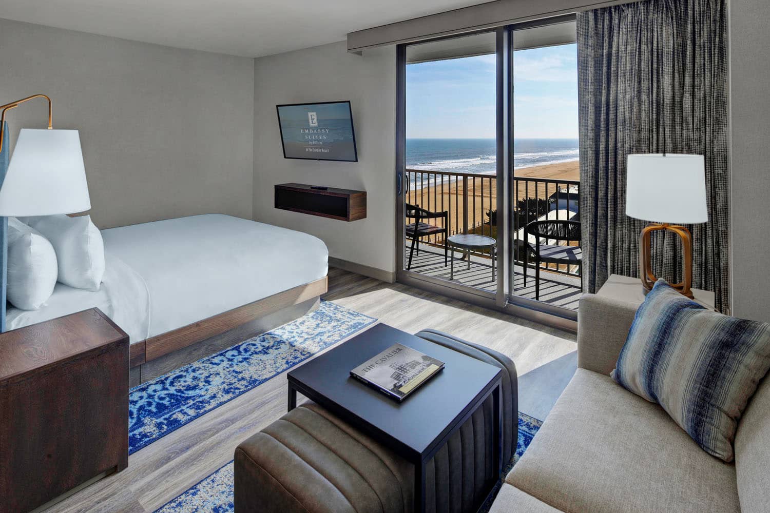 An ocean view King Studio Suite inside the Embassy Suites Virginia Beach Oceanfront Resort