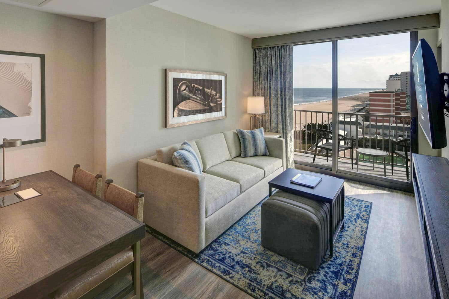 A king two-room suite inside the Embassy Suites Virginia Beach Oceanfront Resort