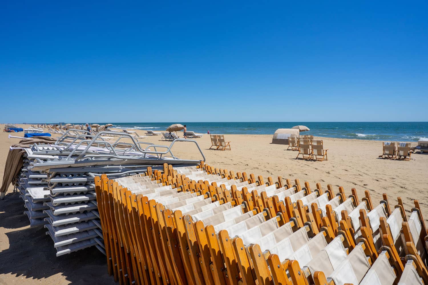 Beach chairs stacked and lineup for guests at the Cavalier Resort