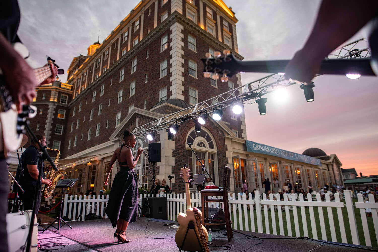 An artist performing on the Great Lawn stage at The Historic Cavalier Hotel