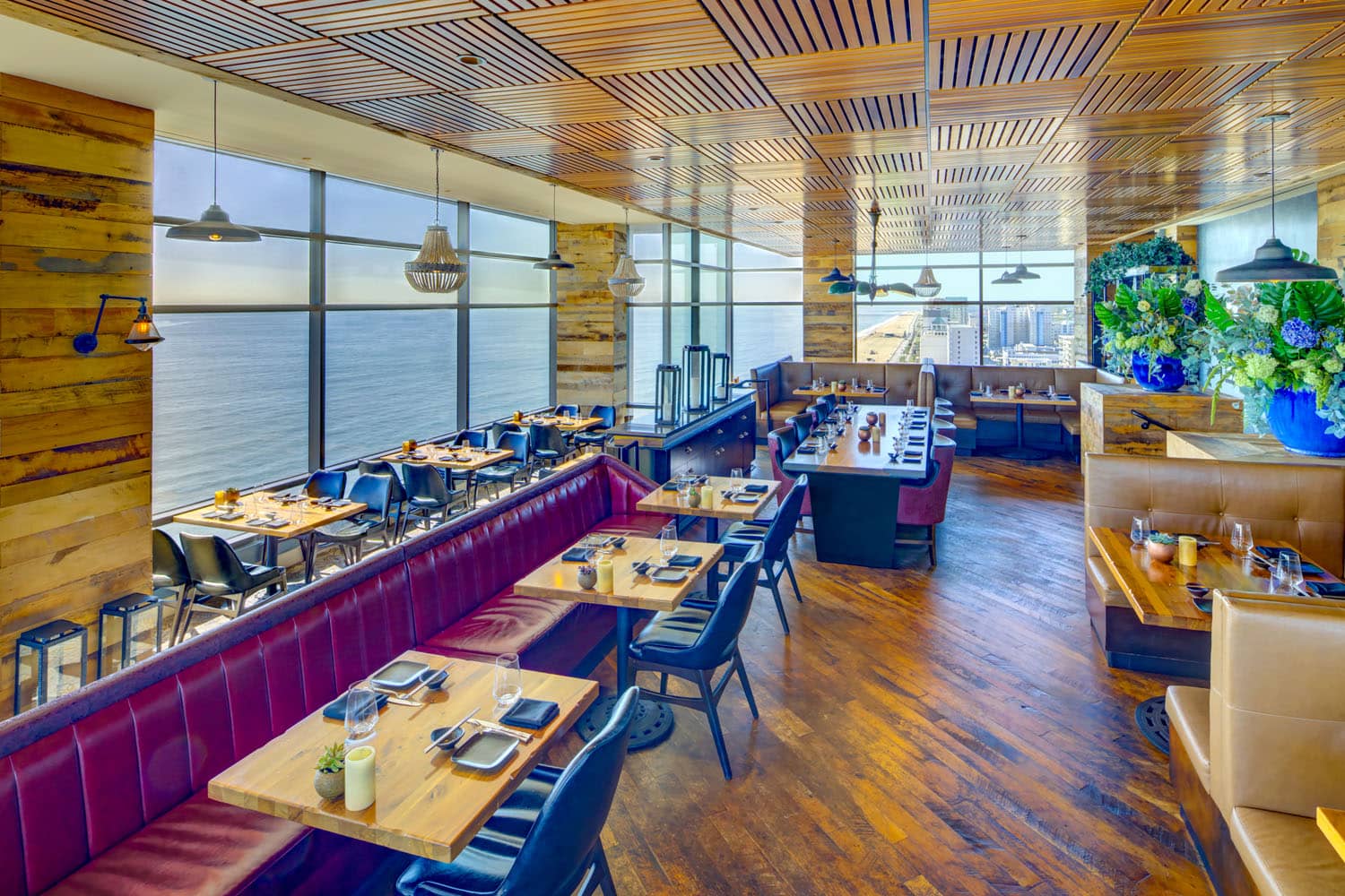 The interior dining room with ocean views inside Orion's Roof restaurant