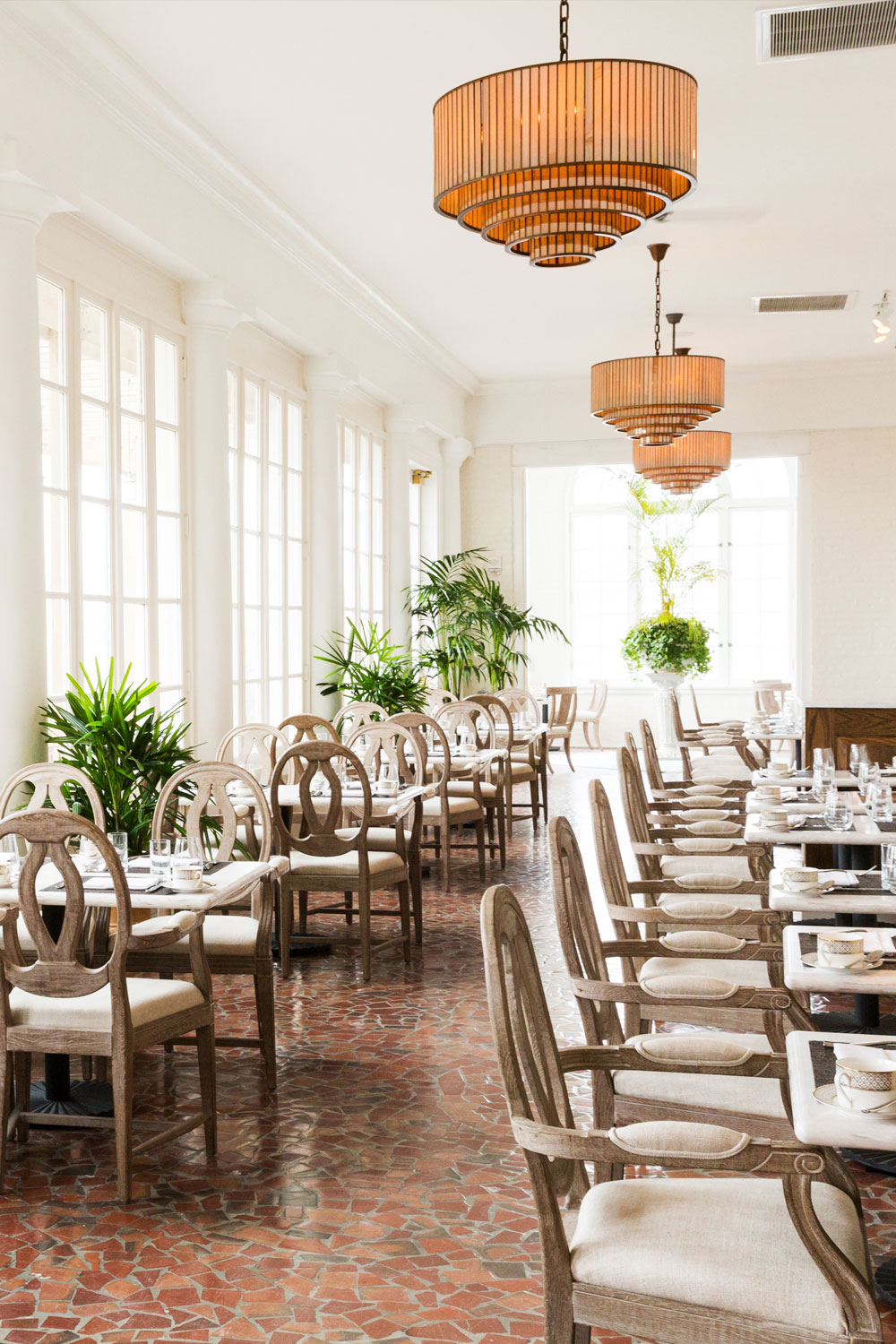 Indoor seating at Becca Restaurant and Gardens in The Historic Cavalier Hotel.